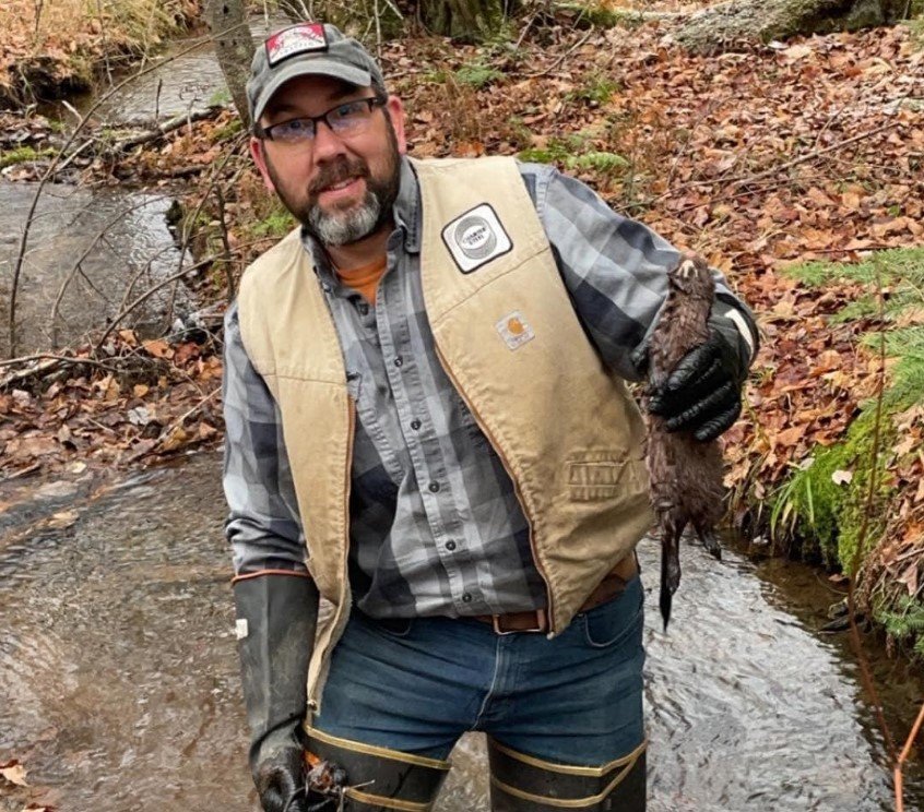 Jeremy the owner with a critter he trapped